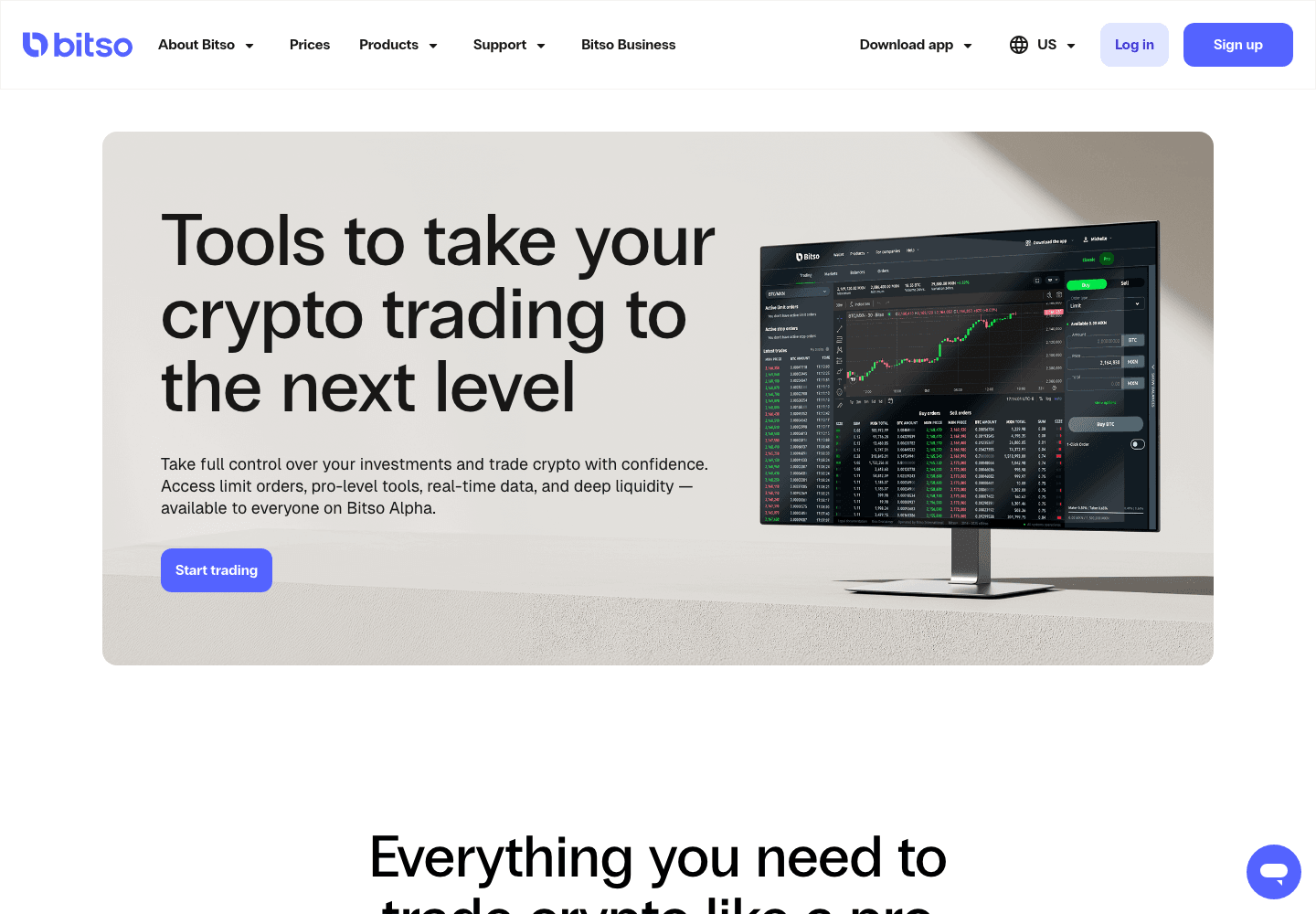 The Bitso Alpha product page hero, showing an order book and candlestick chart on a desktop monitor